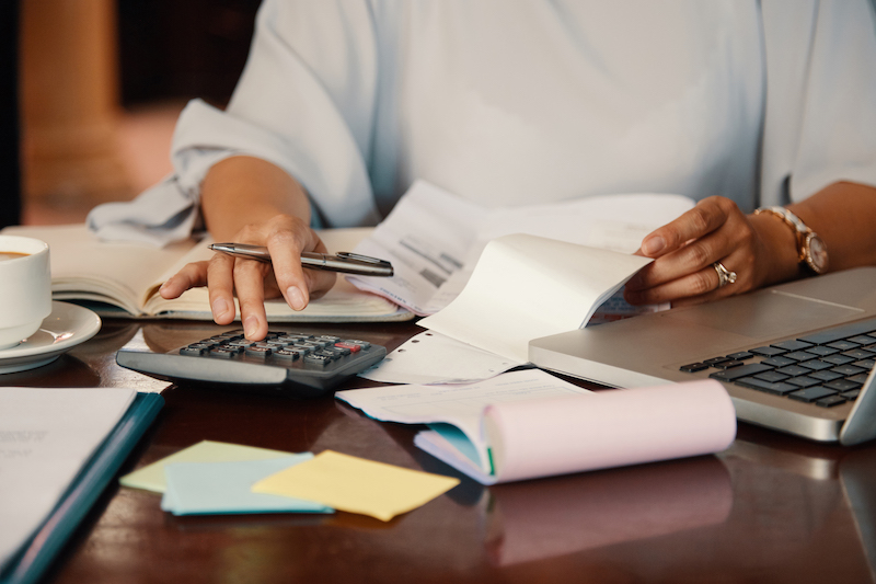 Entrepreneur working with bills Hands of female entrepreneur working with bills and documents